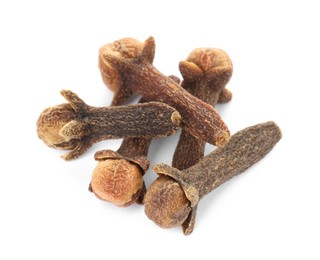 Photo of Dry clove buds on white background. Aromatic spice