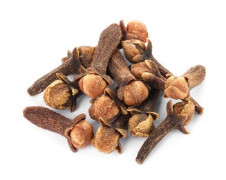 Photo of Pile of dry clove buds on white background. Aromatic spice