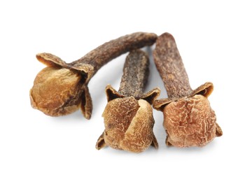 Photo of Dry clove buds on white background. Aromatic spice