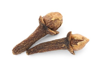 Photo of Dry clove buds on white background, top view. Aromatic spice