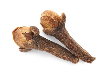 Photo of Dry clove buds on white background, top view. Aromatic spice