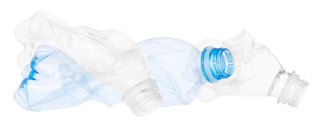 Photo of Crumpled empty plastic bottles isolated on white