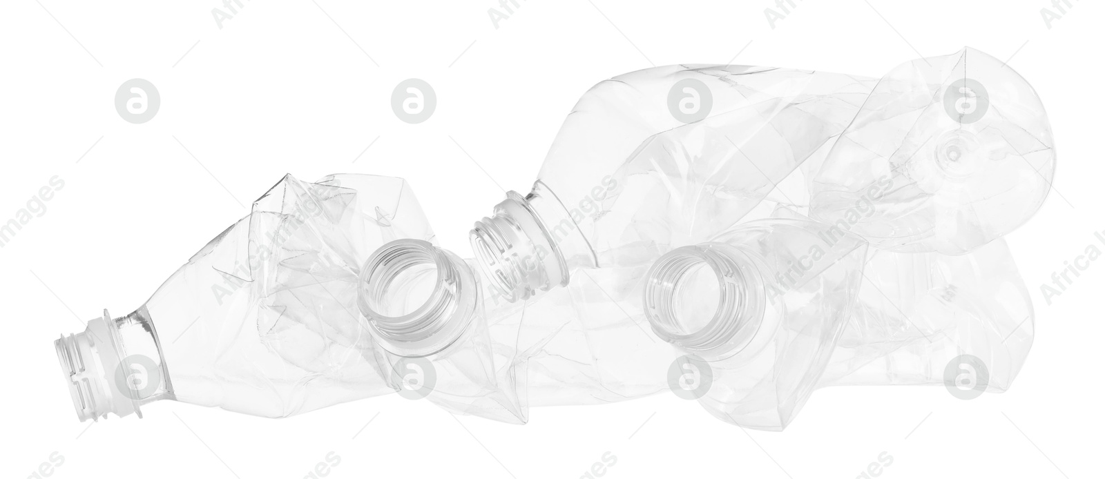 Photo of Crumpled empty plastic bottles isolated on white