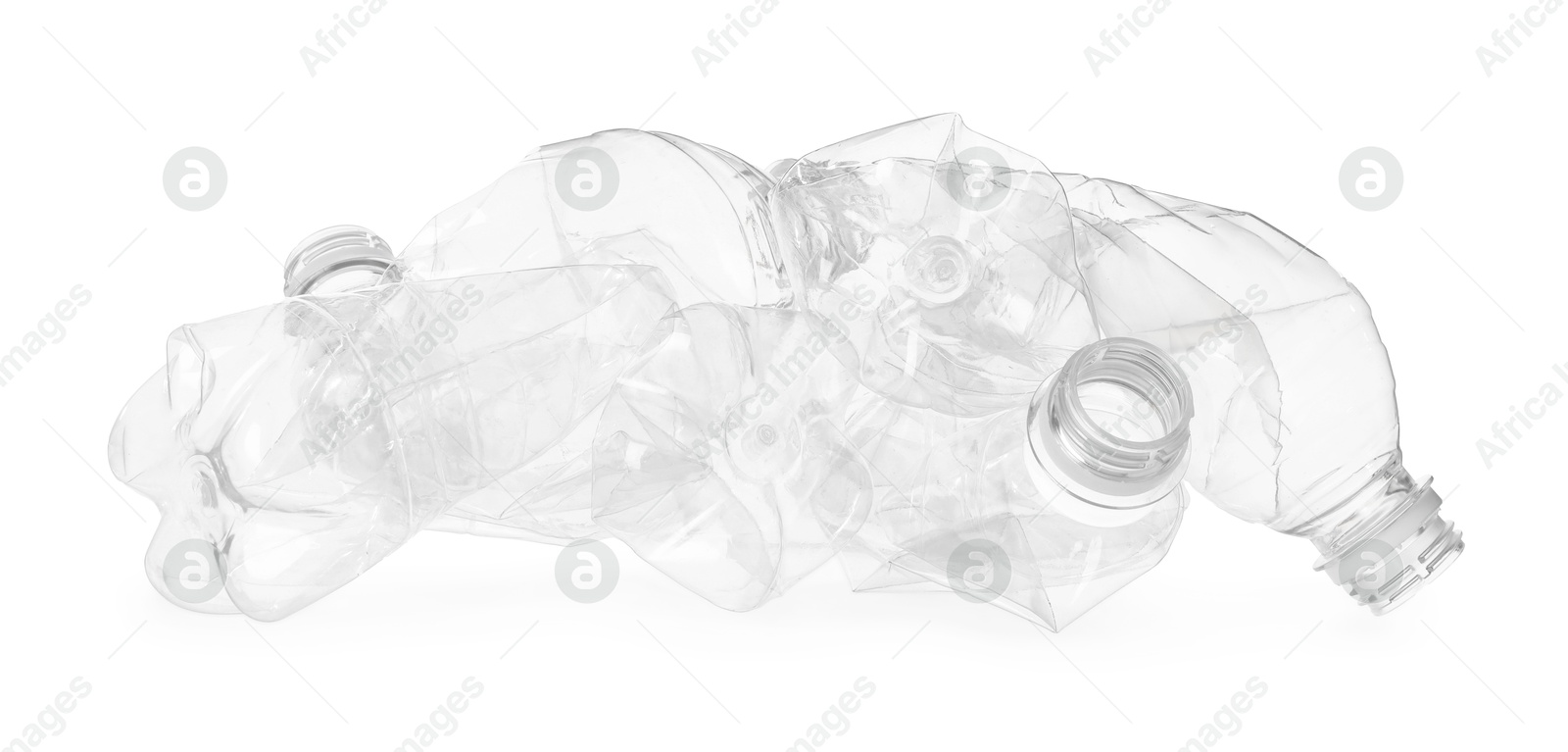 Photo of Crumpled empty plastic bottles isolated on white