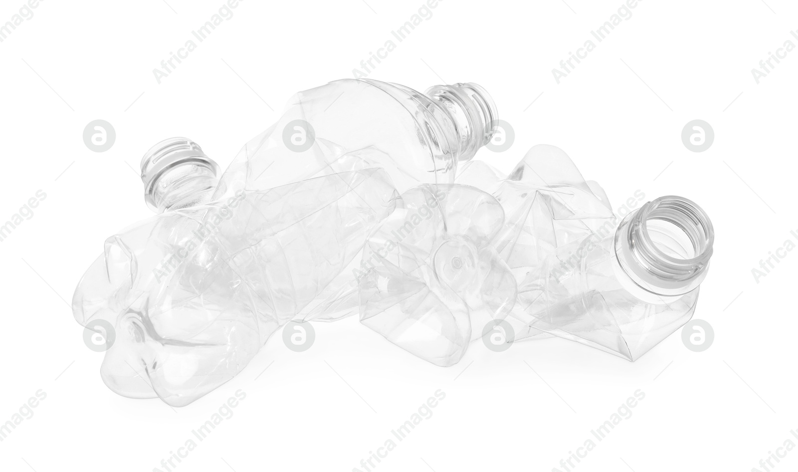 Photo of Crumpled empty plastic bottles isolated on white