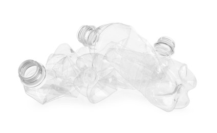 Photo of Crumpled empty plastic bottles isolated on white