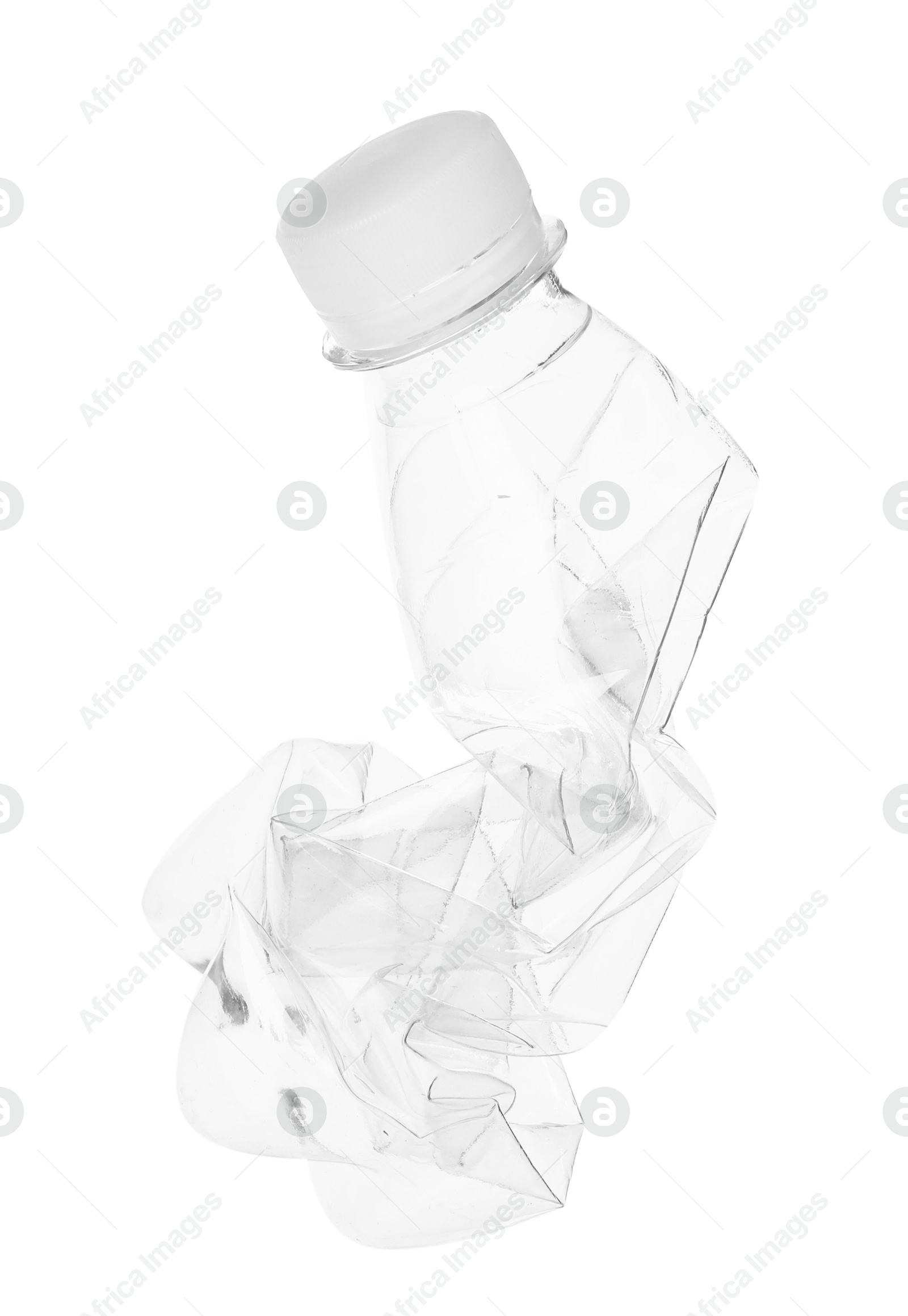 Photo of One crumpled plastic bottle isolated on white