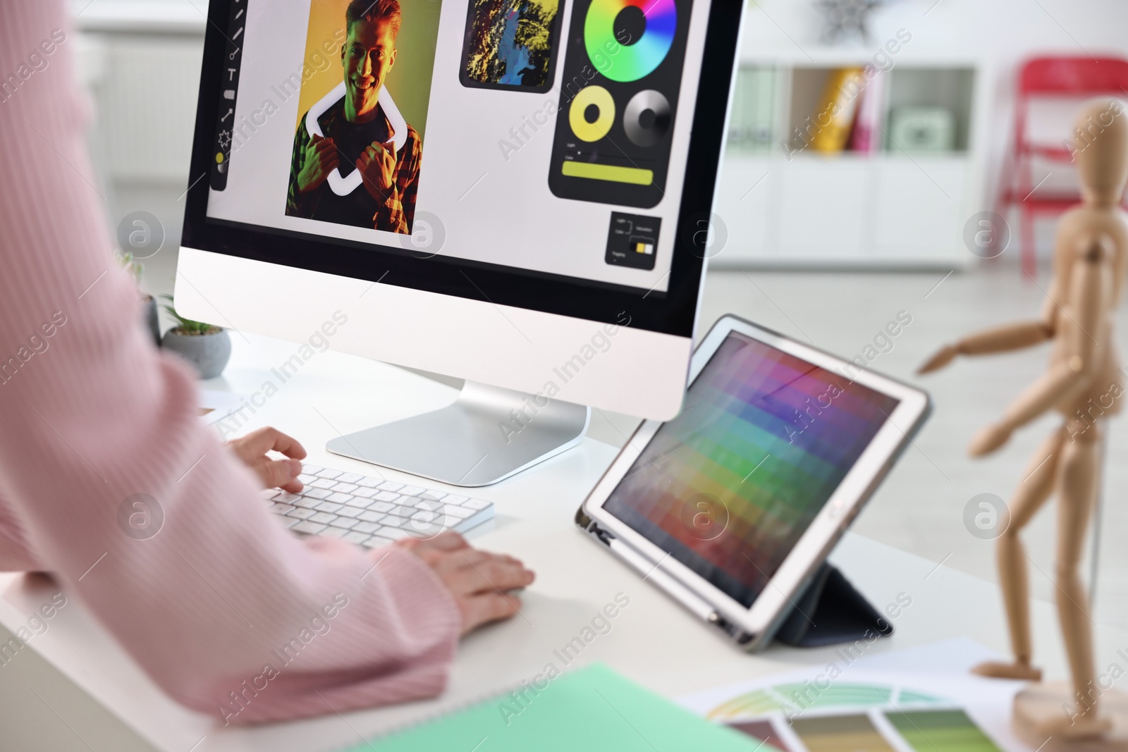 Photo of Designer working at table in office, closeup