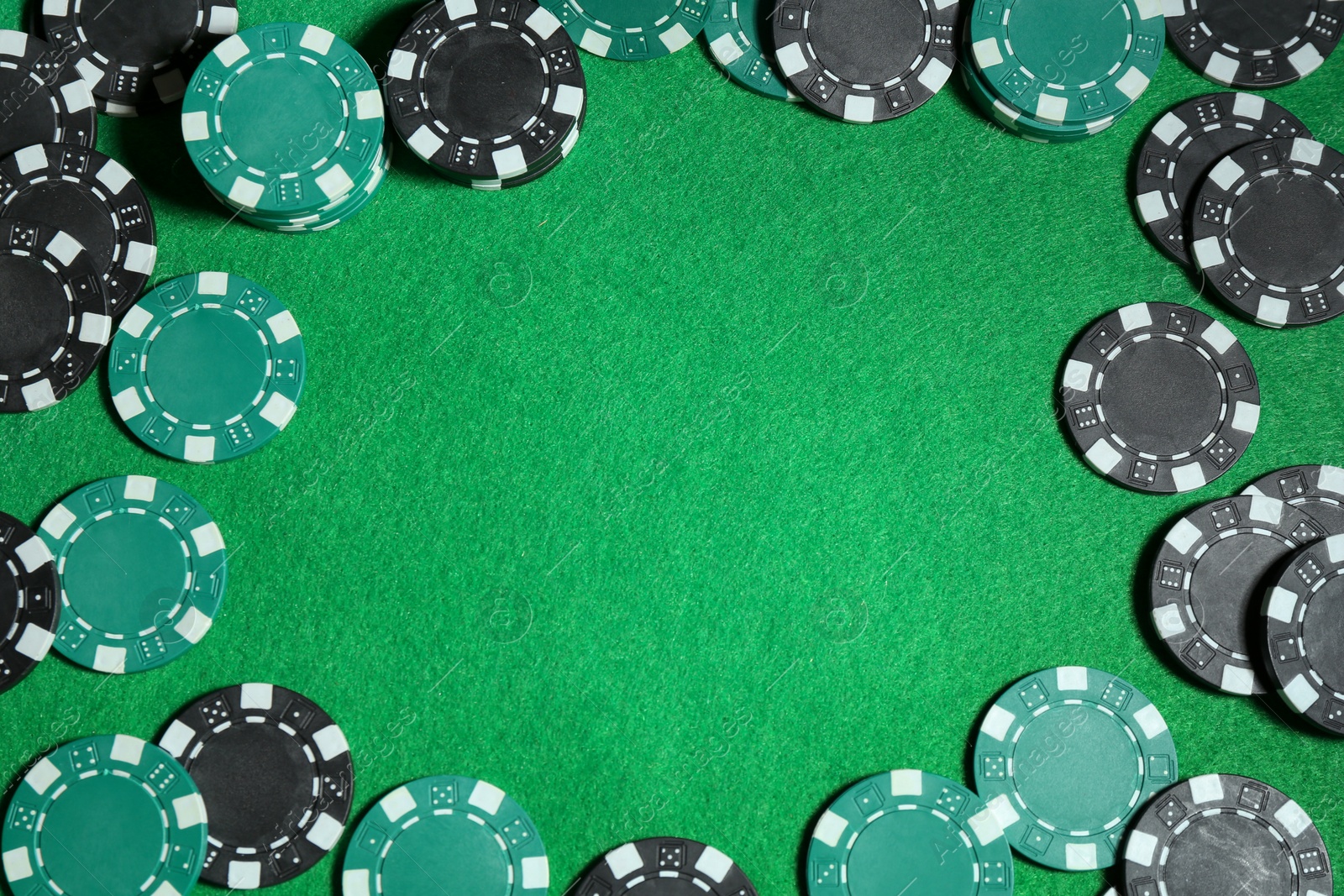 Photo of Poker game. Casino chips on green table, flat lay. Space for text