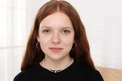 Photo of Portrait of happy teenage girl at home