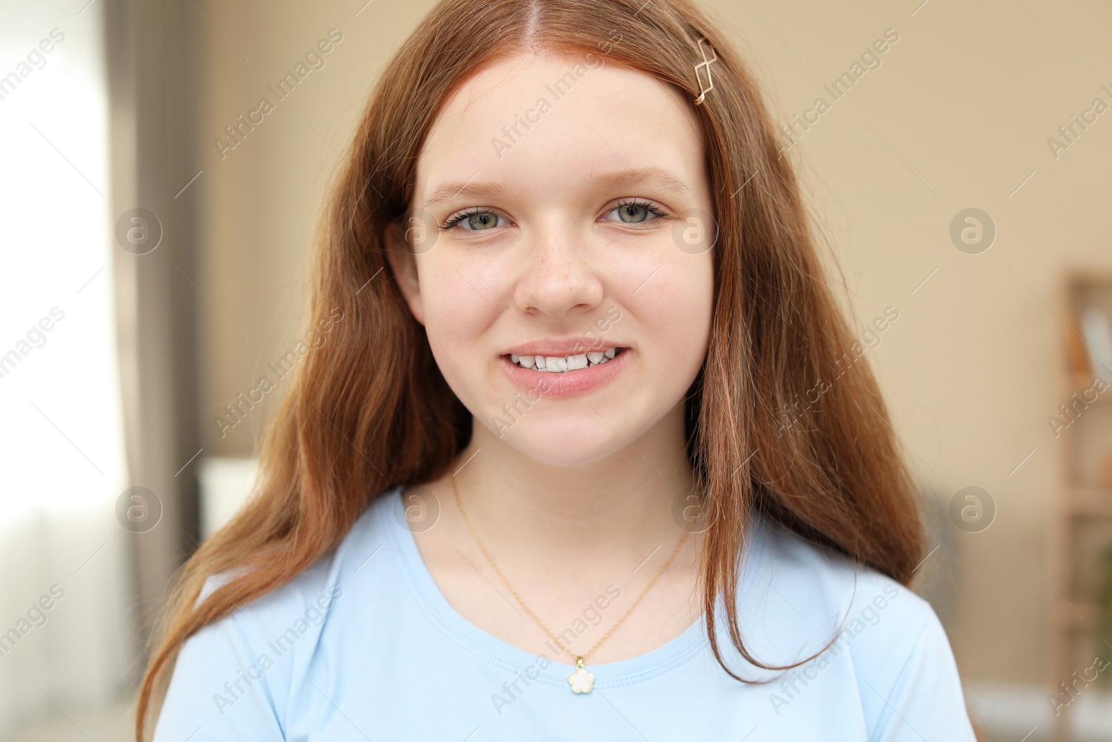 Photo of Portrait of happy teenage girl at home