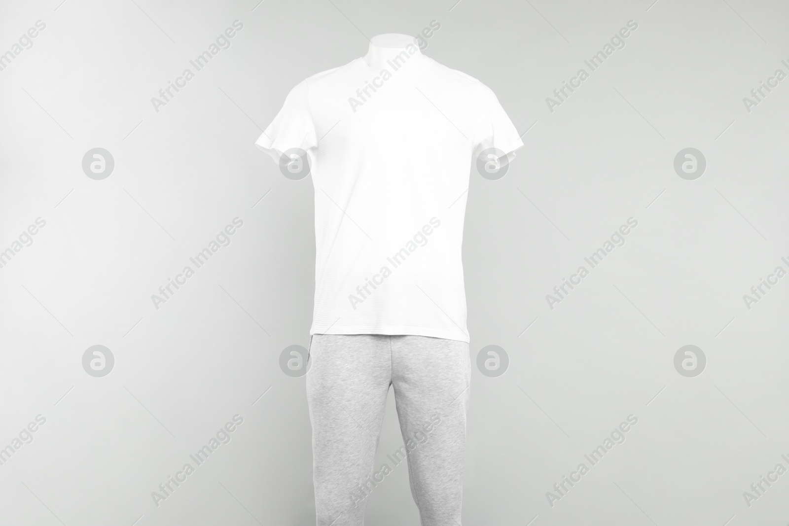 Photo of Male mannequin with stylish outfit on light background