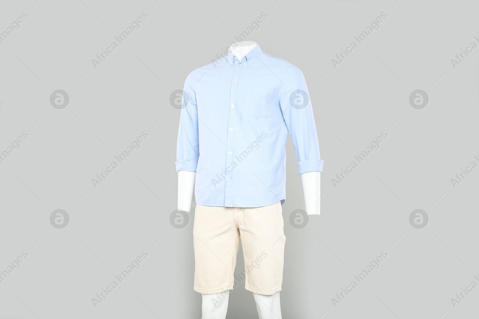 Photo of Male mannequin with stylish outfit on light grey background