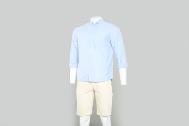 Photo of Male mannequin with stylish outfit on light grey background