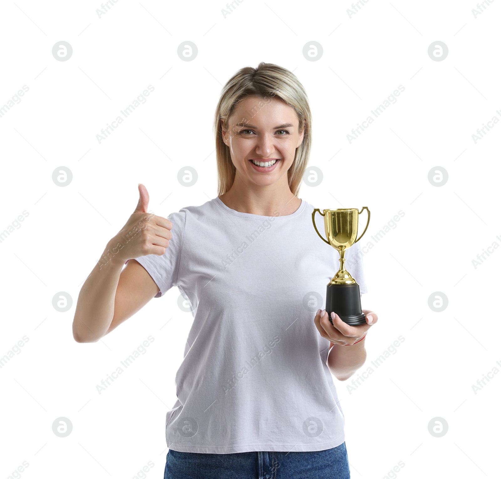 Photo of Happy winner with golden trophy cup showing thumbs up on white background