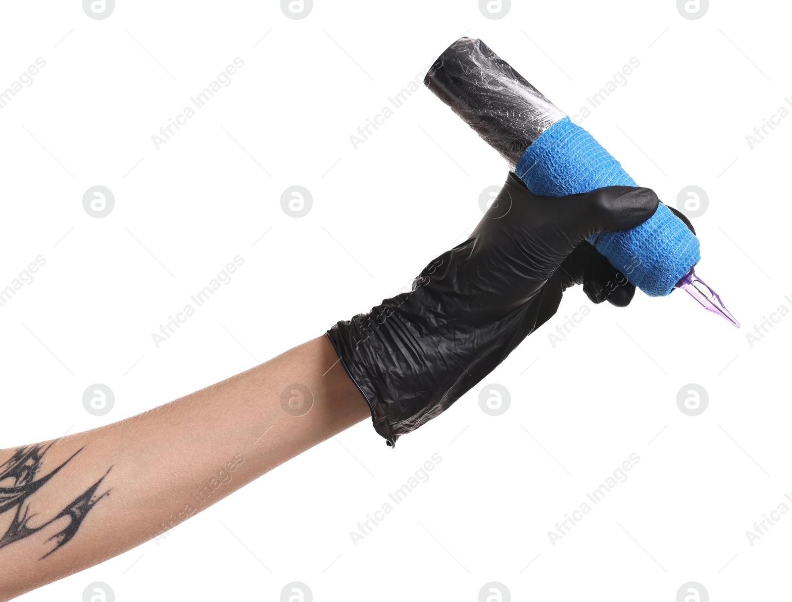 Photo of Professional artist in gloves holding tattoo machine on white background, closeup