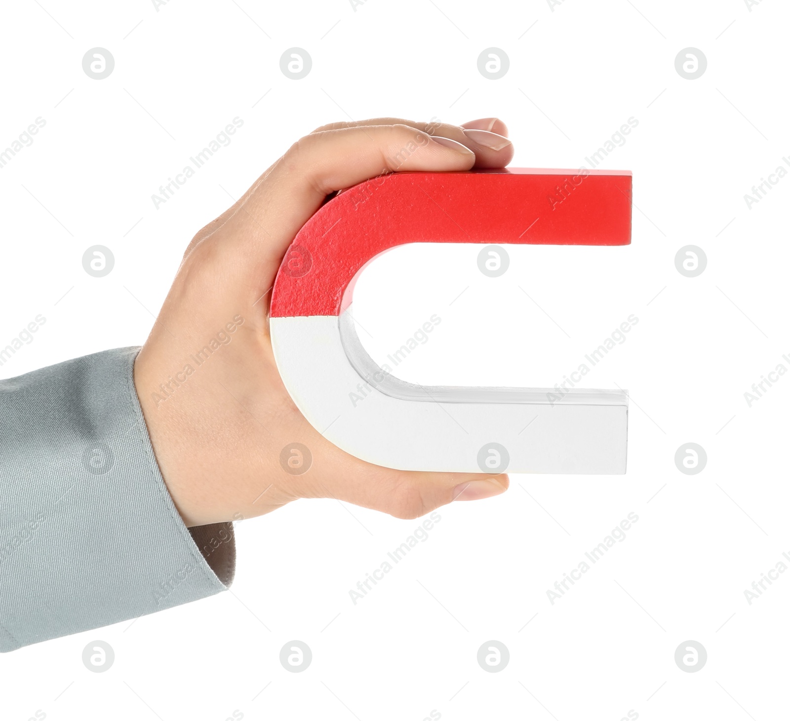 Photo of Woman with horseshoe magnet on white background, closeup