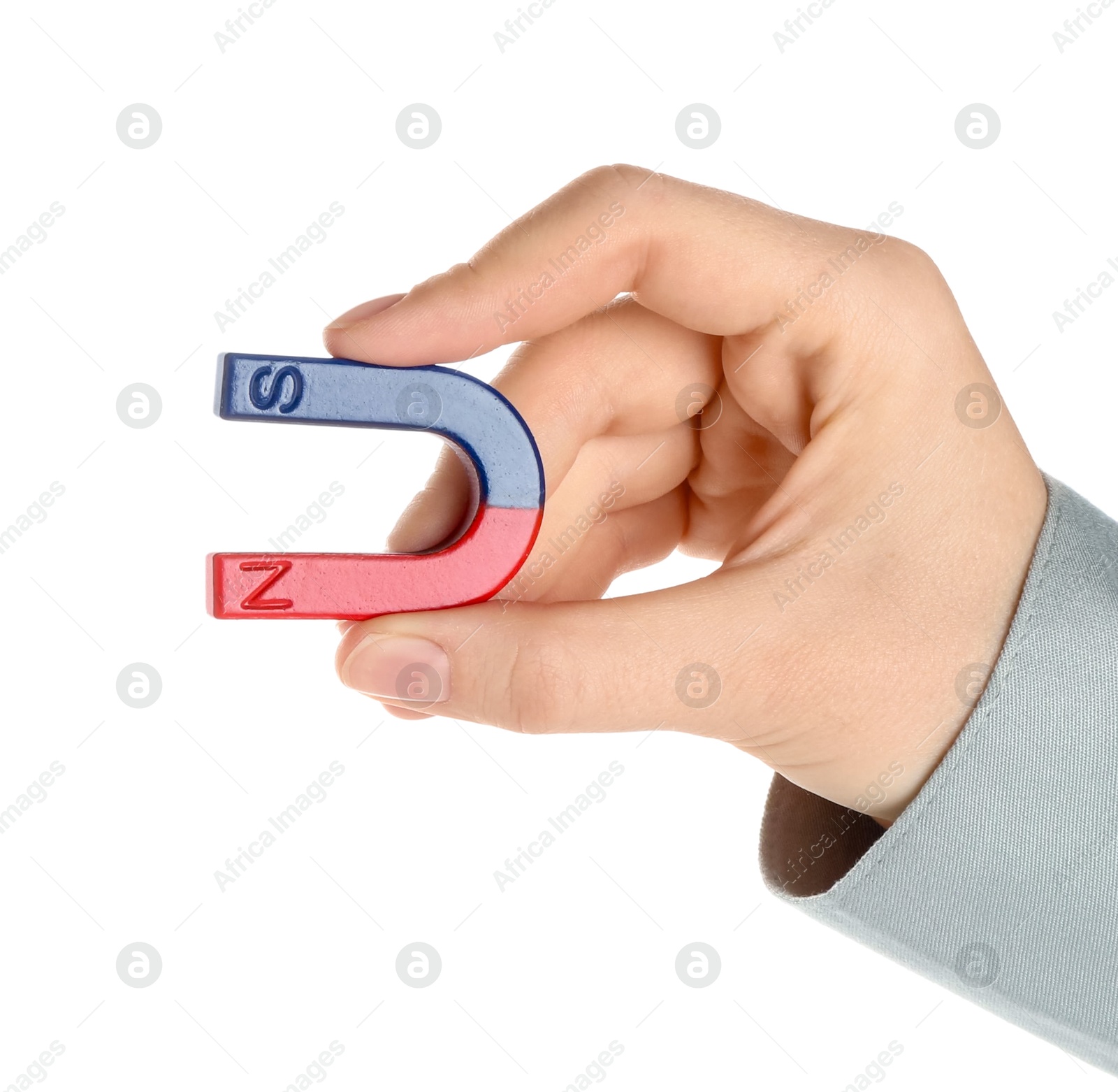 Photo of Woman with horseshoe magnet on white background, closeup