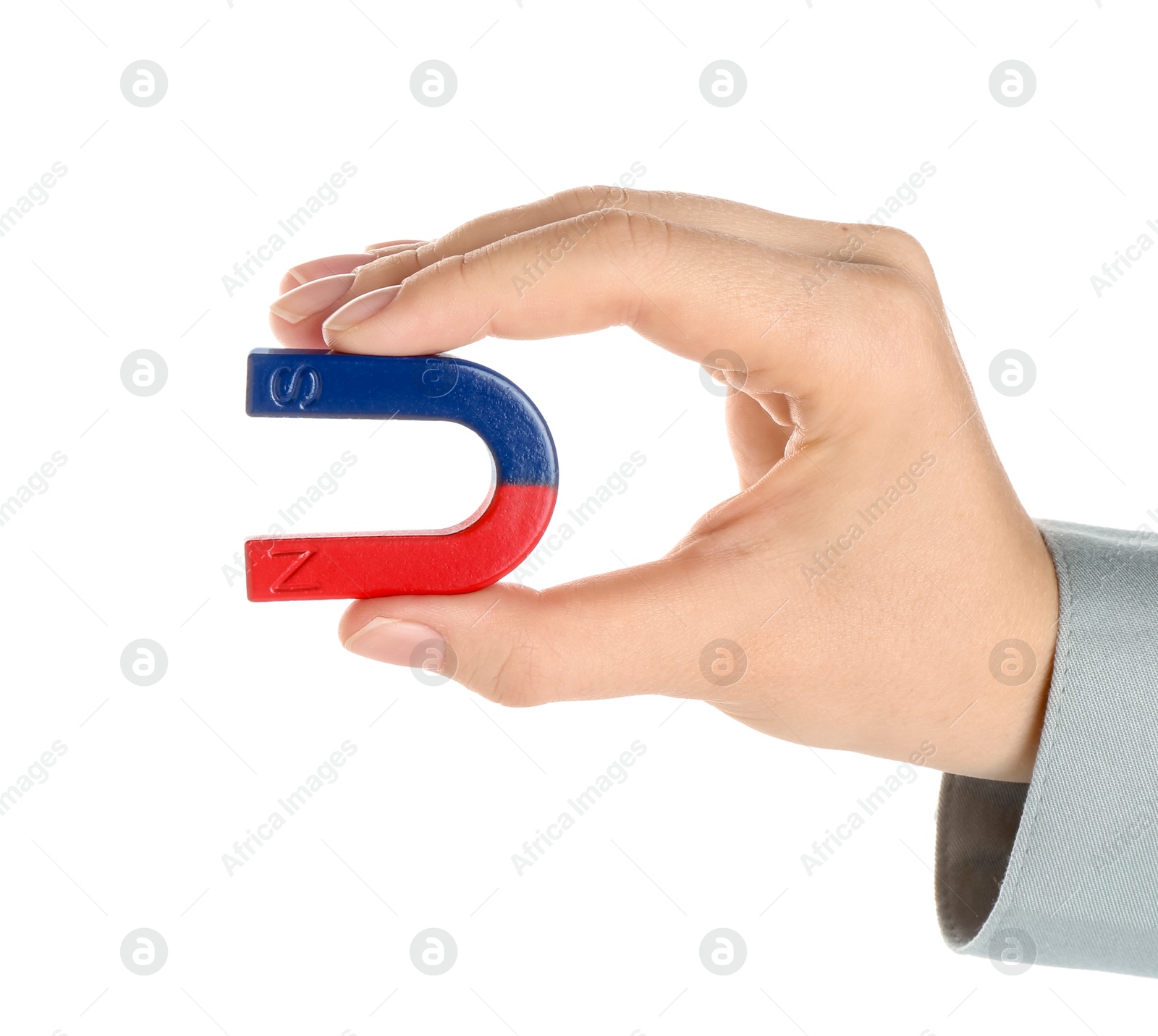 Photo of Woman with horseshoe magnet on white background, closeup