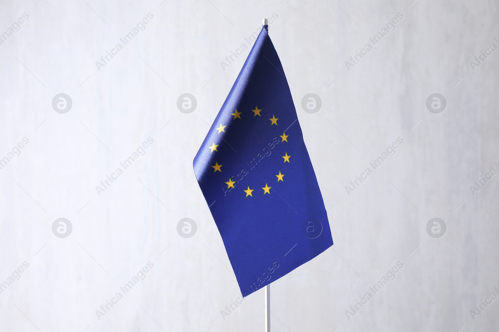 Photo of One flag of European Union on light textured background