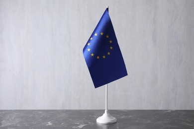 One flag of European Union on grey marble table