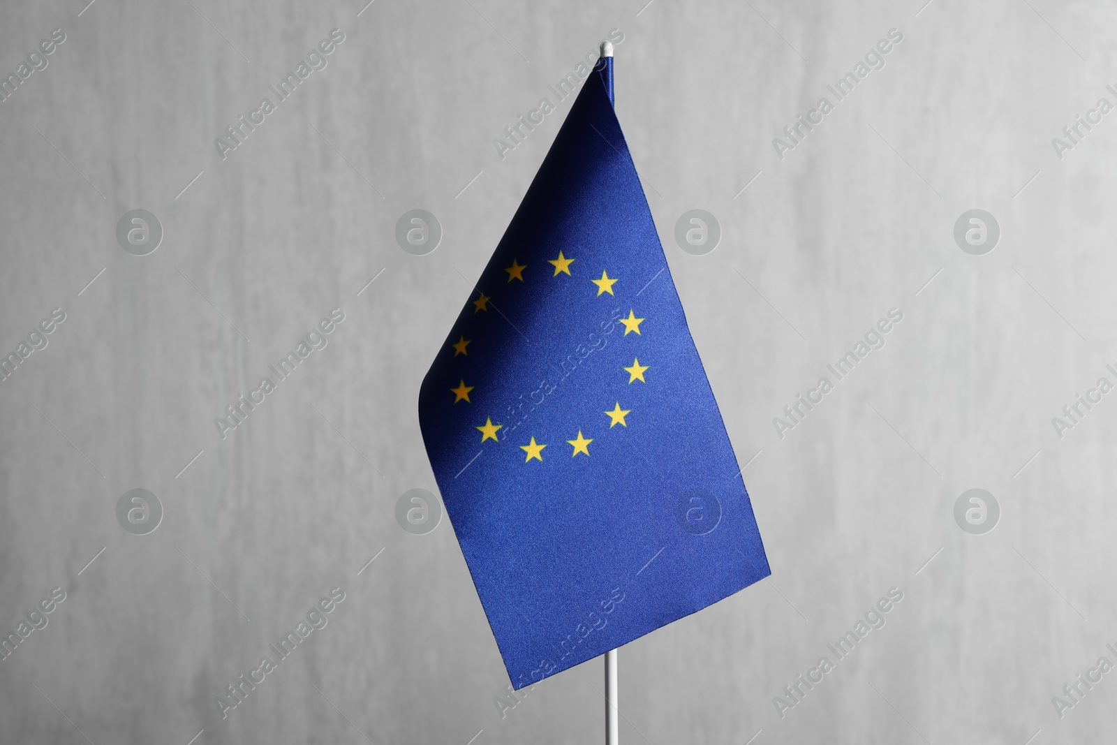 Photo of One flag of European Union on grey textured background