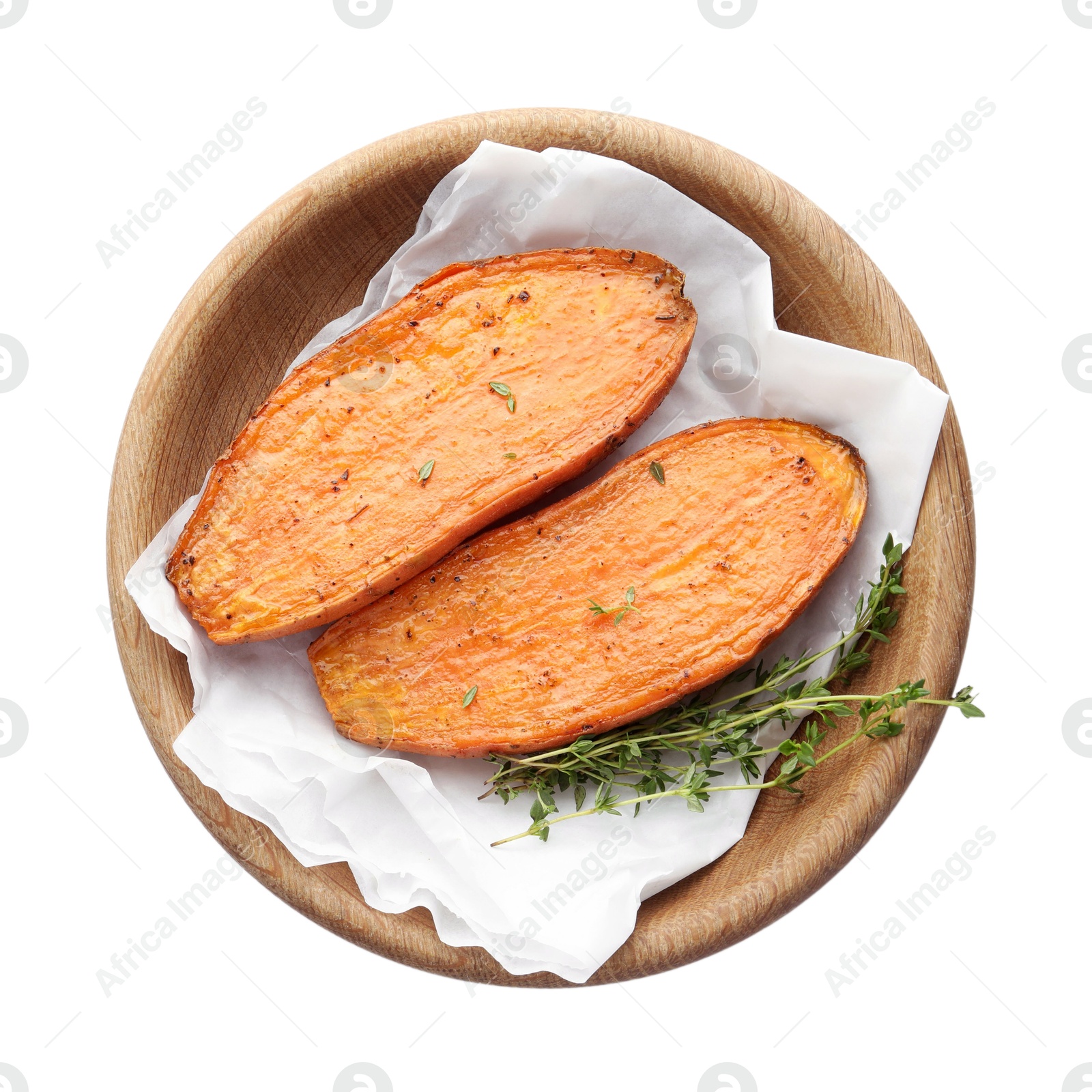 Photo of Halves of tasty cooked sweet potato with thyme isolated on white, top view