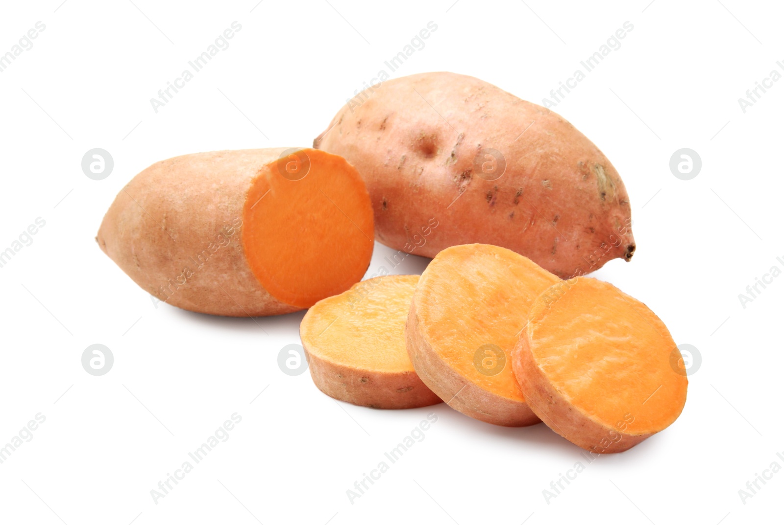 Photo of Fresh raw sweet potatoes isolated on white