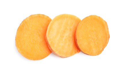 Photo of Pieces of raw sweet potato isolated on white, top view