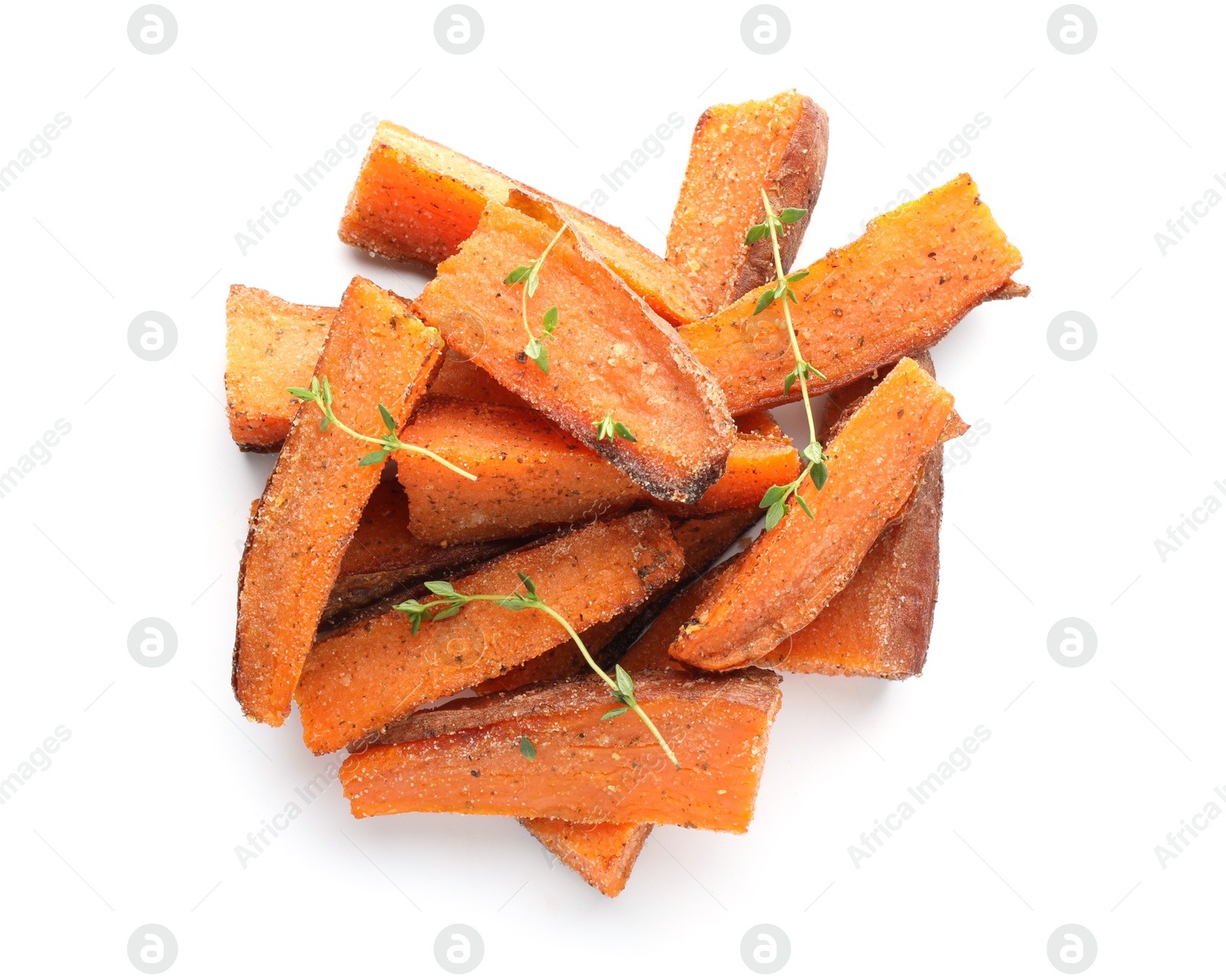 Photo of Pieces of tasty baked sweet potato with microgreens isolated on white, top view