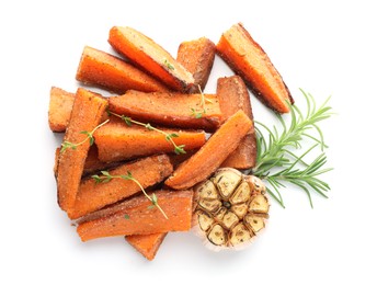 Photo of Pieces of tasty baked sweet potato with microgreens, rosemary and garlic isolated on white, top view