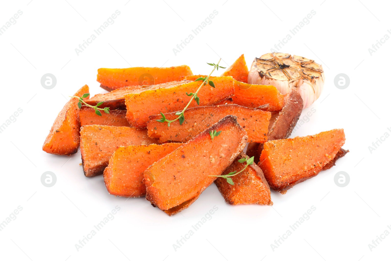 Photo of Pieces of tasty baked sweet potato with microgreens and garlic isolated on white