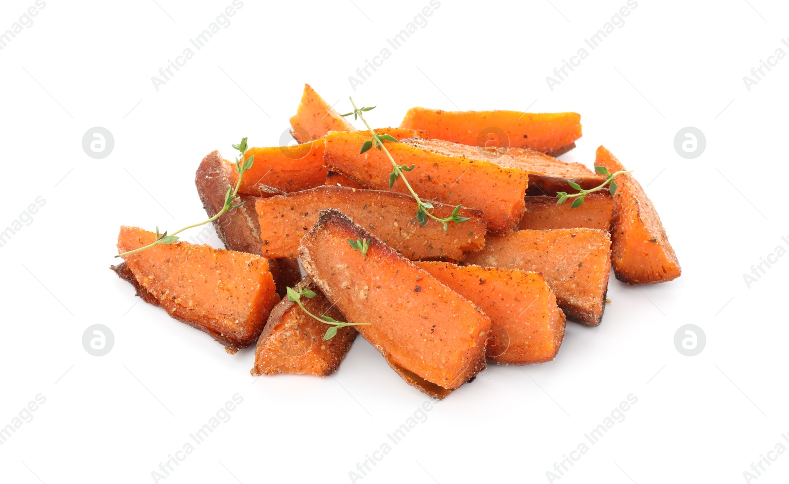 Photo of Pieces of tasty baked sweet potato with microgreens isolated on white