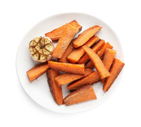 Pieces of tasty baked sweet potato with garlic isolated on white, top view