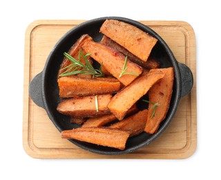 Photo of Pieces of tasty cooked sweet potato with rosemary in baking dish isolated on white, top view