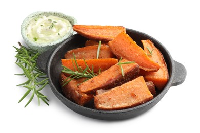 Photo of Pieces of tasty cooked sweet potato and rosemary in baking dish served with sauce isolated on white