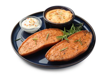 Halves of tasty baked sweet potato served with sauces isolated on white