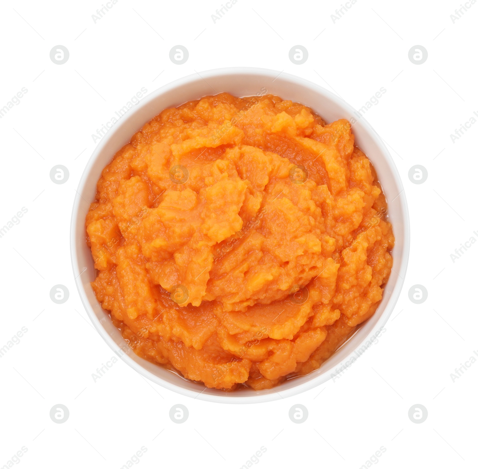 Photo of Tasty mashed sweet potato in bowl isolated on white, top view