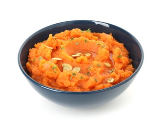 Photo of Tasty mashed sweet potato with pumpkin seeds and thyme in bowl isolated on white