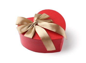 Photo of Heart shaped gift box with golden bow isolated on white