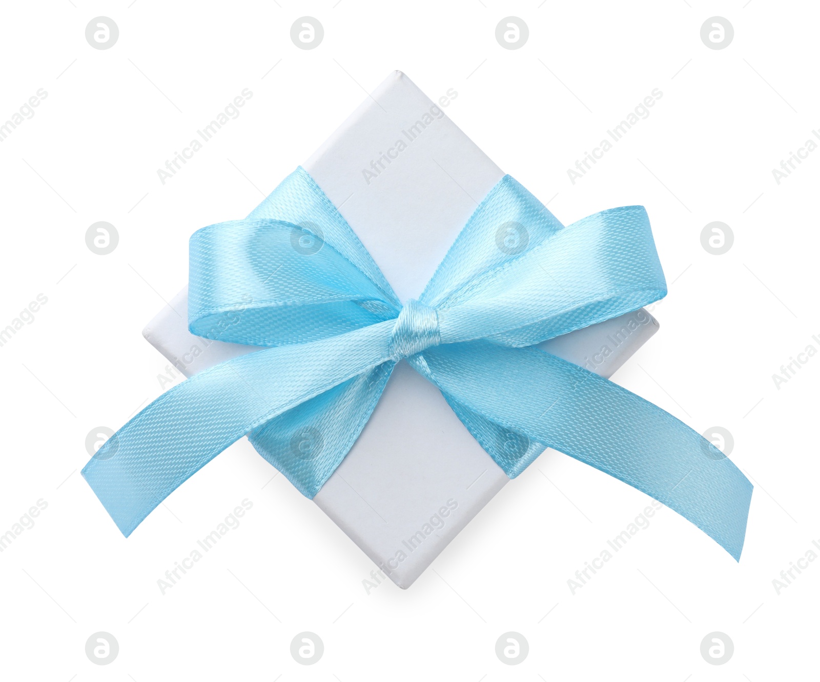 Photo of Beautiful gift box with light blue bow isolated on white, top view