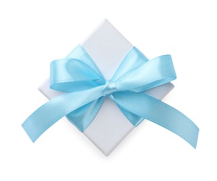 Photo of Beautiful gift box with light blue bow isolated on white, top view