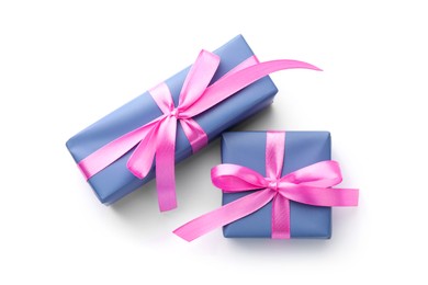 Photo of Beautiful gift boxes with pink bows isolated on white, top view