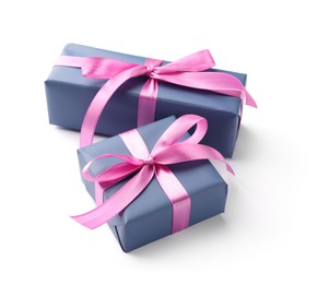 Photo of Beautiful gift boxes with pink bows isolated on white