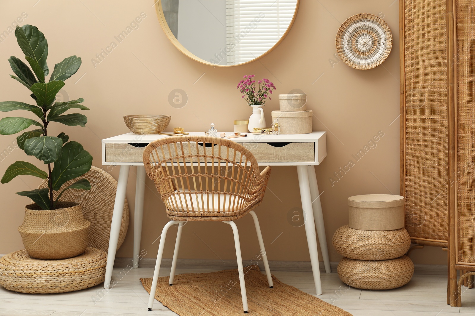 Photo of Stylish dressing table with mirror in room