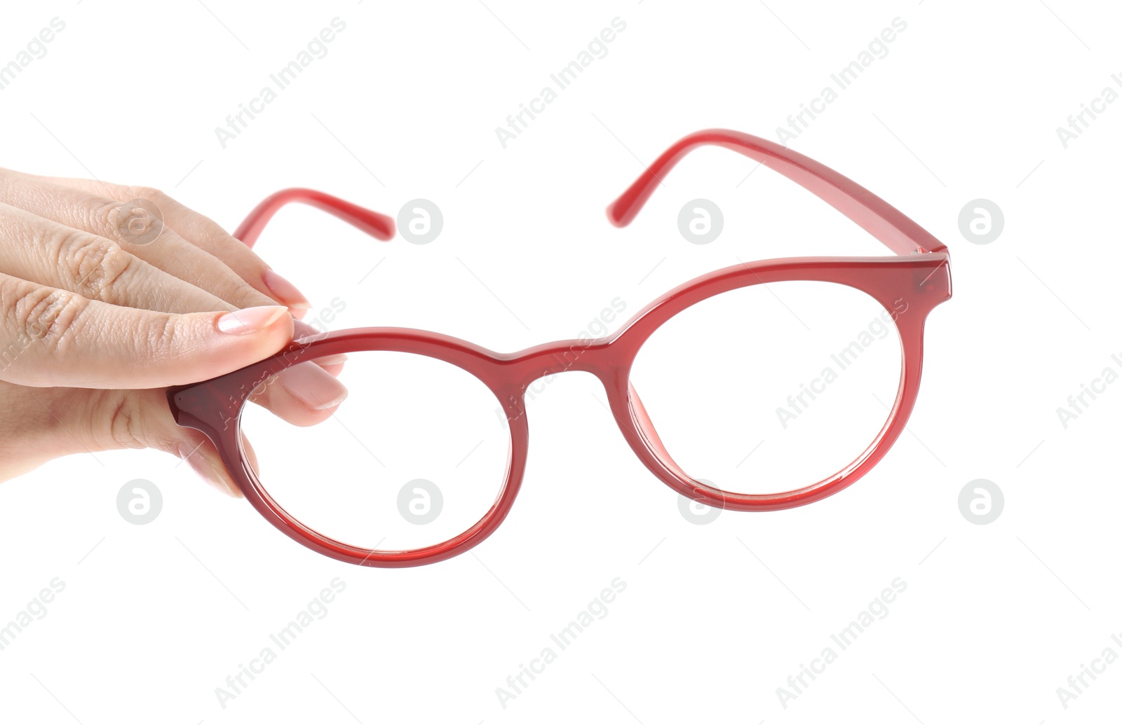 Photo of Woman holding glasses with red frame on white background, closeup