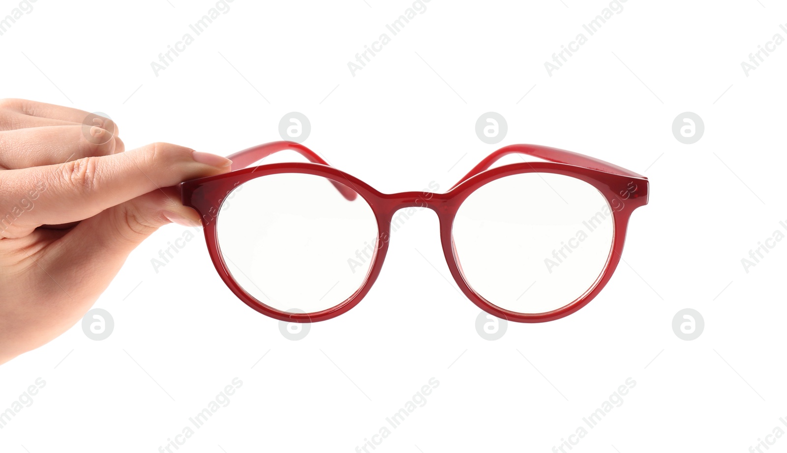 Photo of Woman holding glasses with red frame on white background, closeup