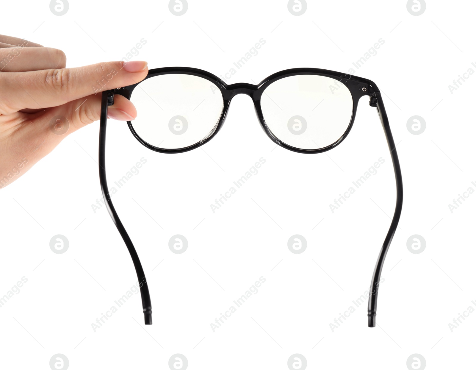 Photo of Woman holding glasses with black frame on white background, closeup