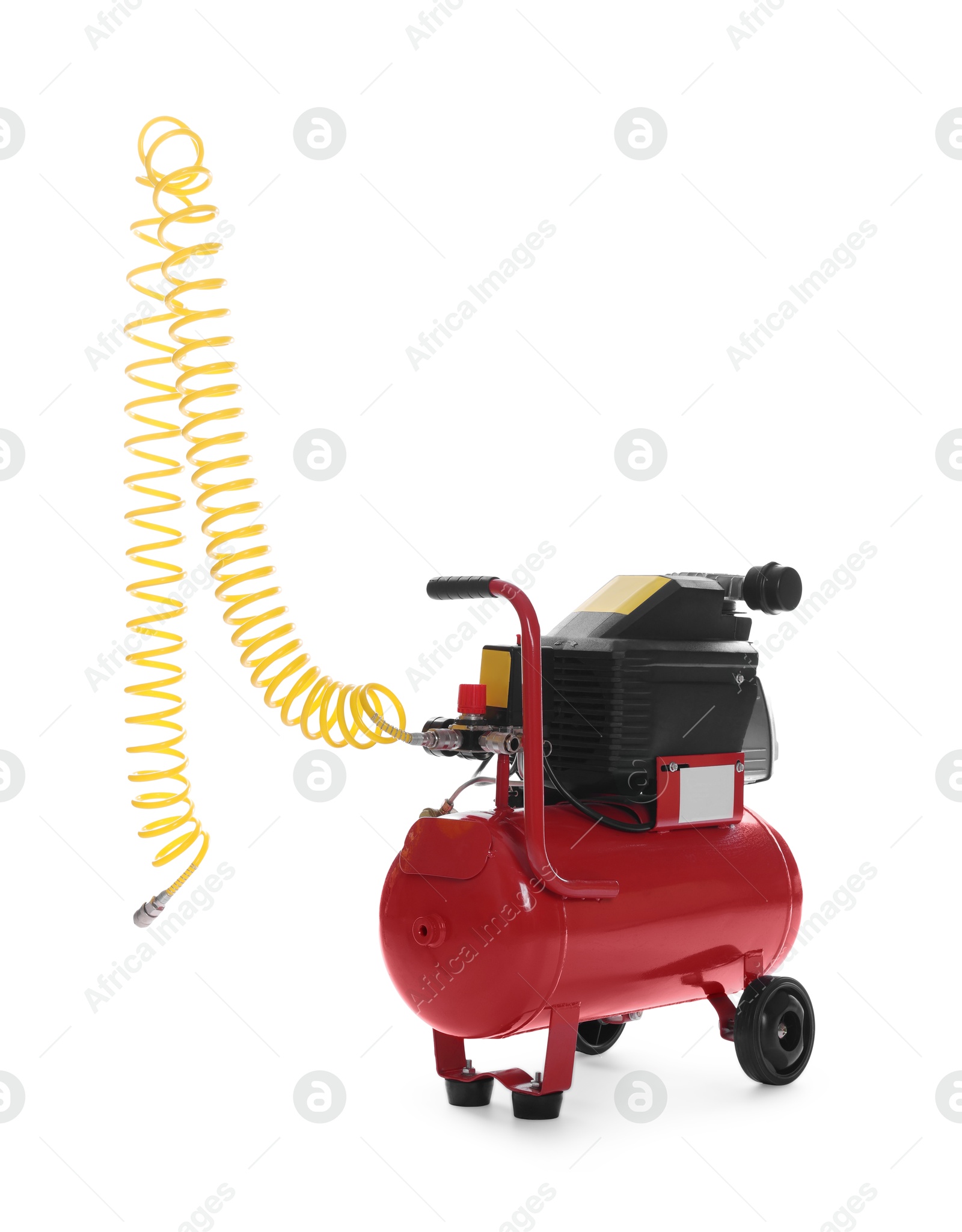 Photo of Air compressor with coiled hose isolated on white