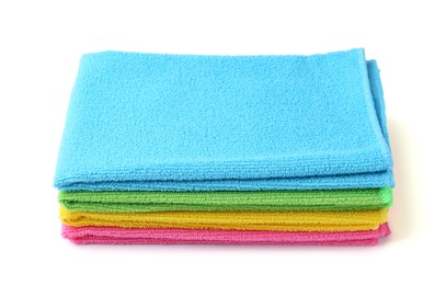 Photo of Stack of different microfiber cloths isolated on white